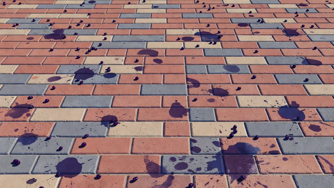 A close-up view of weathered brick pavers showcasing vibrant dark purple berry stains splattered across the textured surface. Bright natural light highlights the grit and patterns on the outdoor driveway.