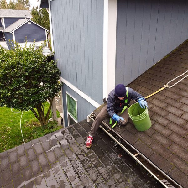 gutter cleaning professional cleaning gutter with bucket
