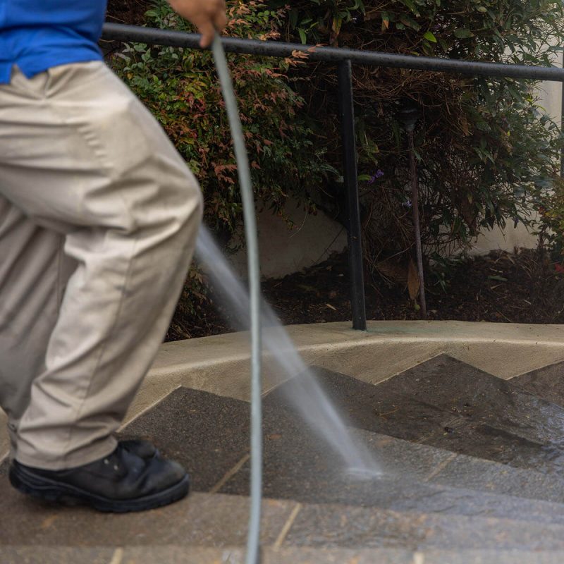 pressure washing professionals washing paver steps