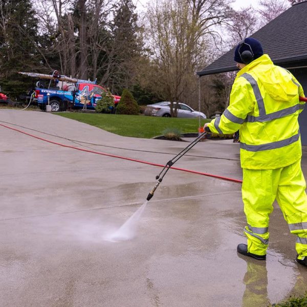 pressure washing professional yellow coat uniform cleaning concrete
